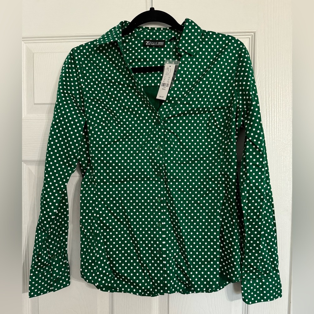 Green blouse with white polkadots. New with tags size small.